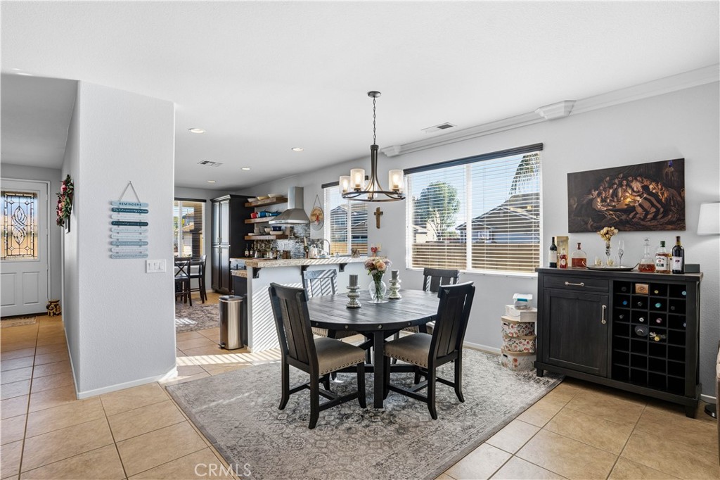 29183 Paperflower Lane Menifee, CA 92584 - Photo 10 of 49 a dining room with furniture and window