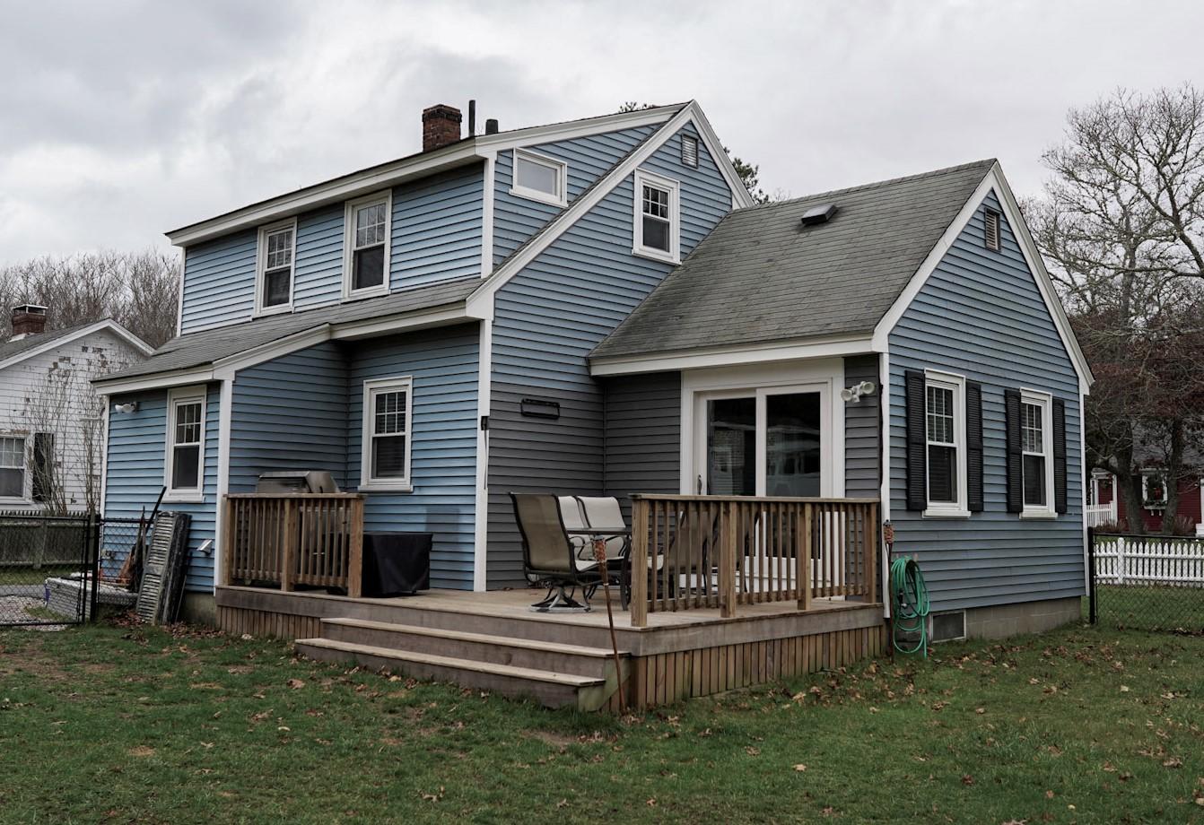 64 Camp Opechee Road Centerville, MA 02632 - Photo 23 of 26 a front view of a house with a yard