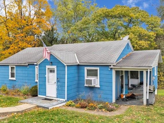 1004-1006 Gringo Road Aliquippa, PA 15001 - Photo 3 of 7 a front view of a house with a yard