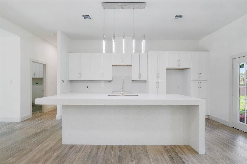 2291 Riverside Drive West Columbia, TX 77486 - Photo 22 of 50 a kitchen with stainless steel appliances a sink stove and cabinets