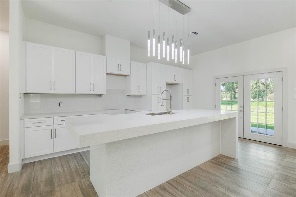 2291 Riverside Drive West Columbia, TX 77486 - Photo 28 of 50 a kitchen with stainless steel appliances granite countertop a sink a stove and cabinets