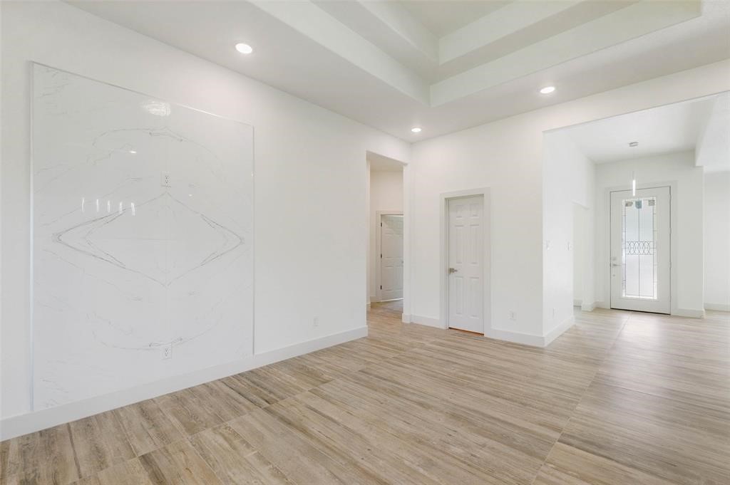 2291 Riverside Drive West Columbia, TX 77486 - Photo 31 of 50 a view of an empty room with wooden floor
