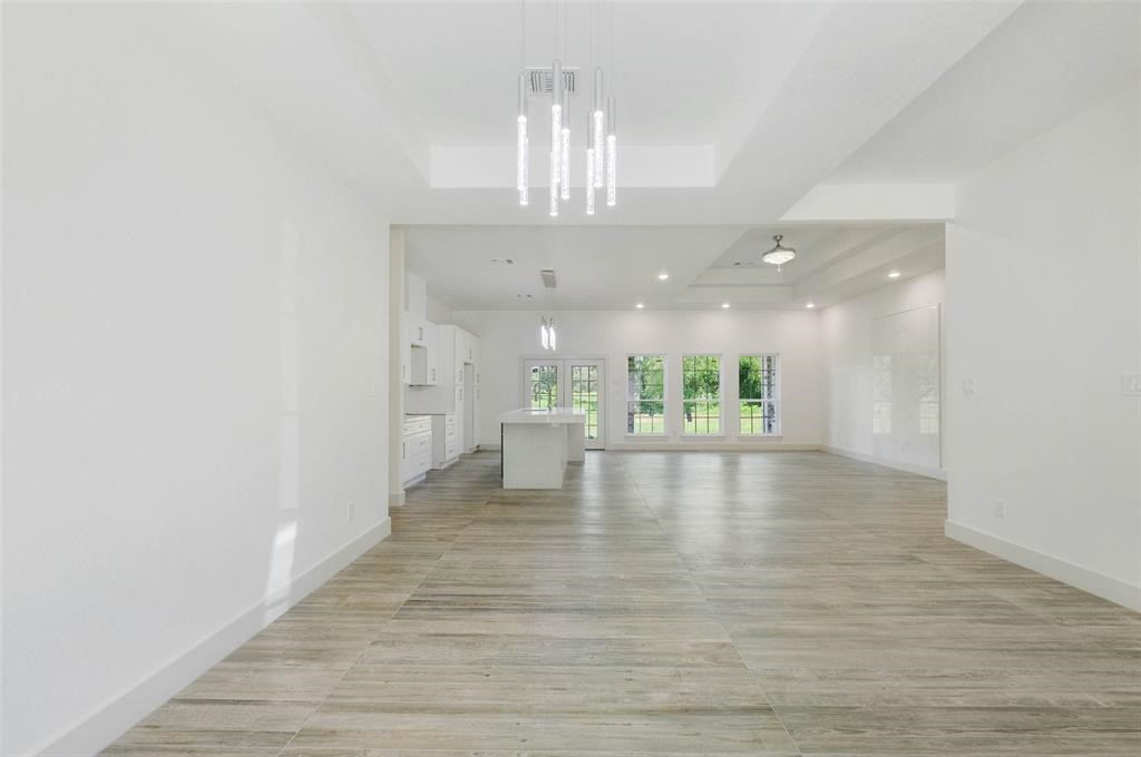 2291 Riverside Drive West Columbia, TX 77486 - Photo 33 of 50 a view of an empty room with window and wooden floor