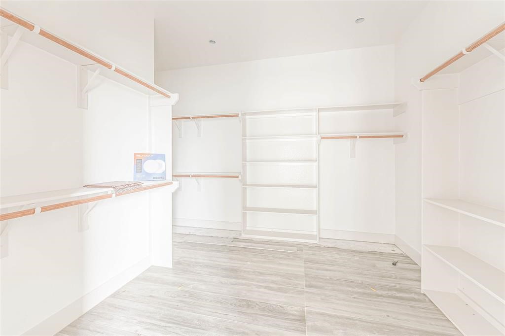 2291 Riverside Drive West Columbia, TX 77486 - Photo 41 of 50 a view of a kitchen with white cabinets and wooden floor