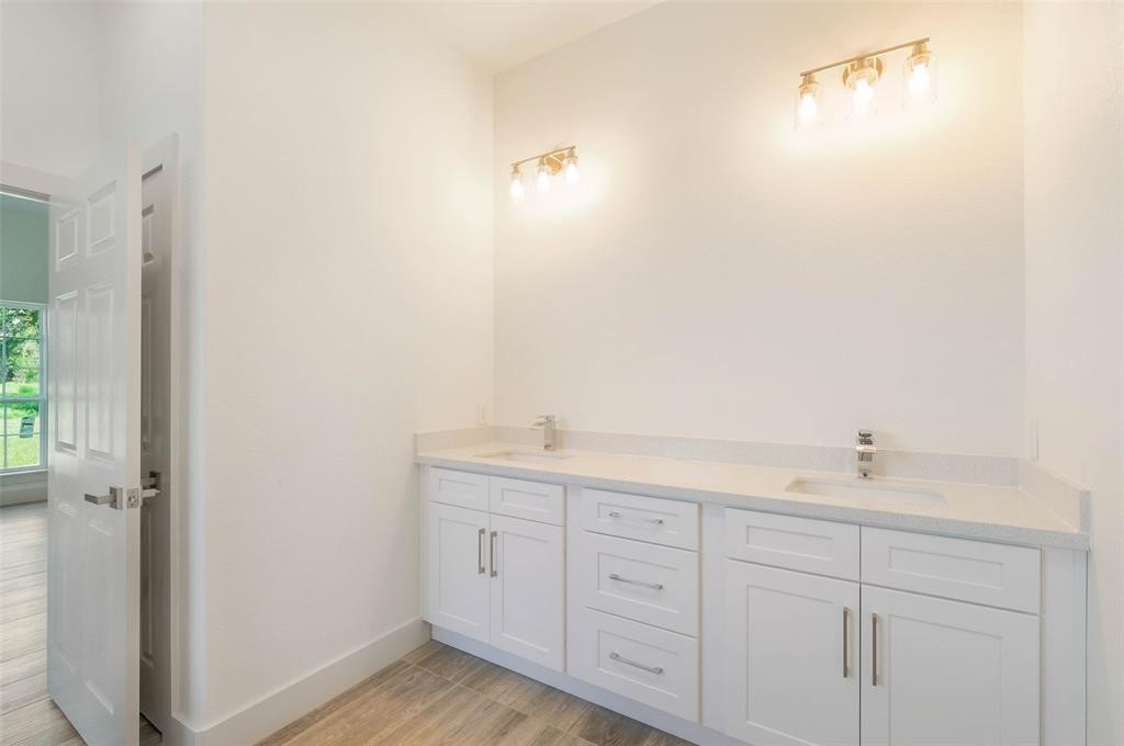 2291 Riverside Drive West Columbia, TX 77486 - Photo 43 of 50 a bathroom with a granite countertop sink and a mirror