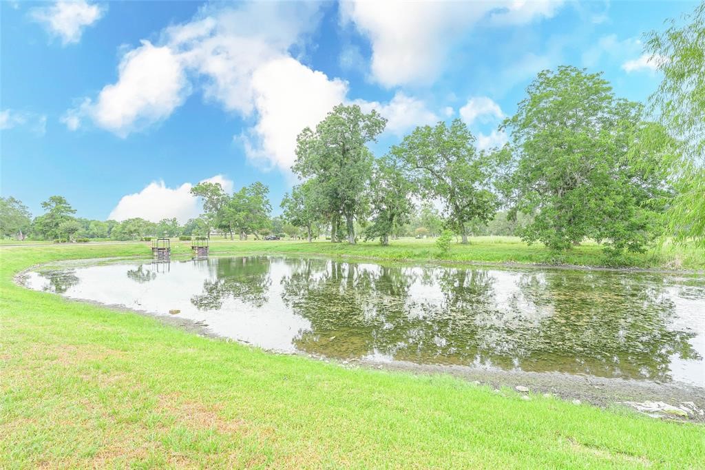 2291 Riverside Drive West Columbia, TX 77486 - Photo 49 of 50 a view of a lake with a yard