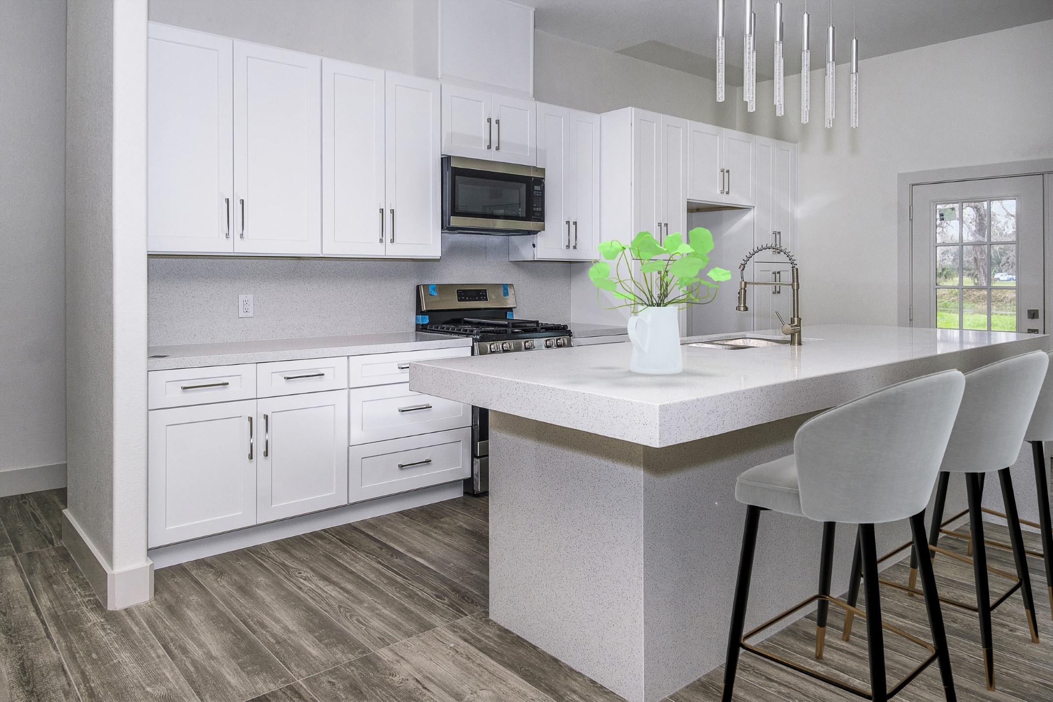 2291 Riverside Drive West Columbia, TX 77486 - Photo 6 of 50 a kitchen with white cabinets stainless steel appliances and a potted plant