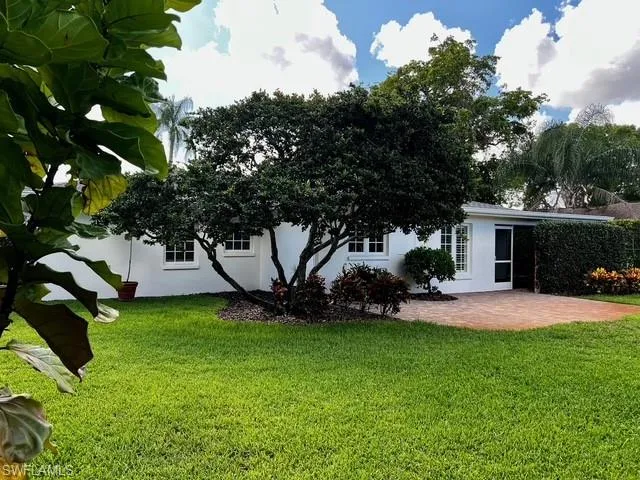 a house view with a garden space