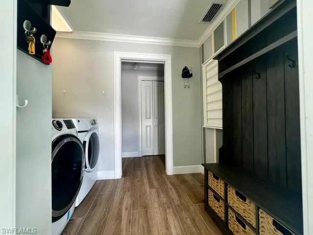 a view of a bedroom with washer and dryer