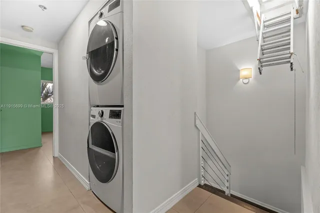 a view of a hallway with washer and dryer