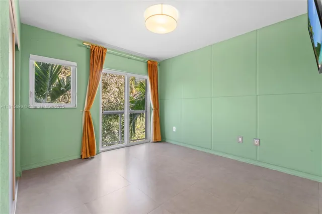 a view of room with window and hardwood floor