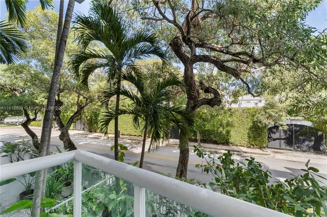 a view of a house with a tree