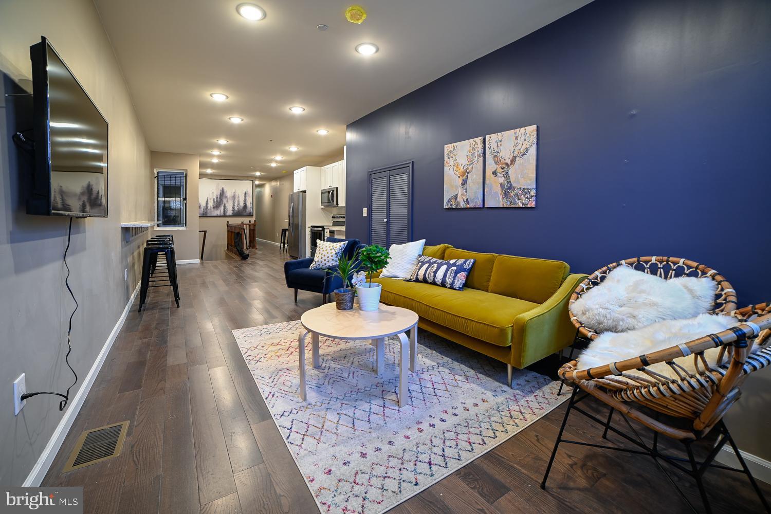 1848 North 16th Street, Unit 1 Philadelphia, PA 19121 - Photo 2 of 24 a living room with furniture and a wooden floor