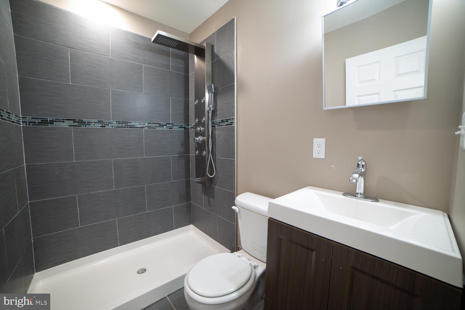 1848 North 16th Street, Unit 1 Philadelphia, PA 19121 - Photo 23 of 24 a bathroom with a sink a toilet and shower