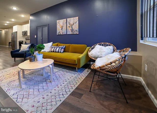 a living room with furniture and a rug