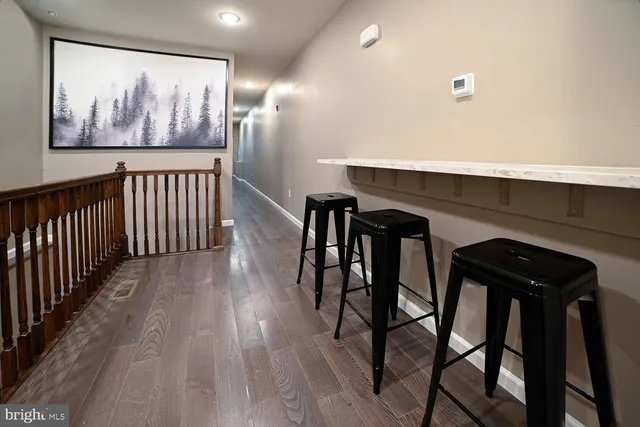 a dinning room with furniture and wooden floor