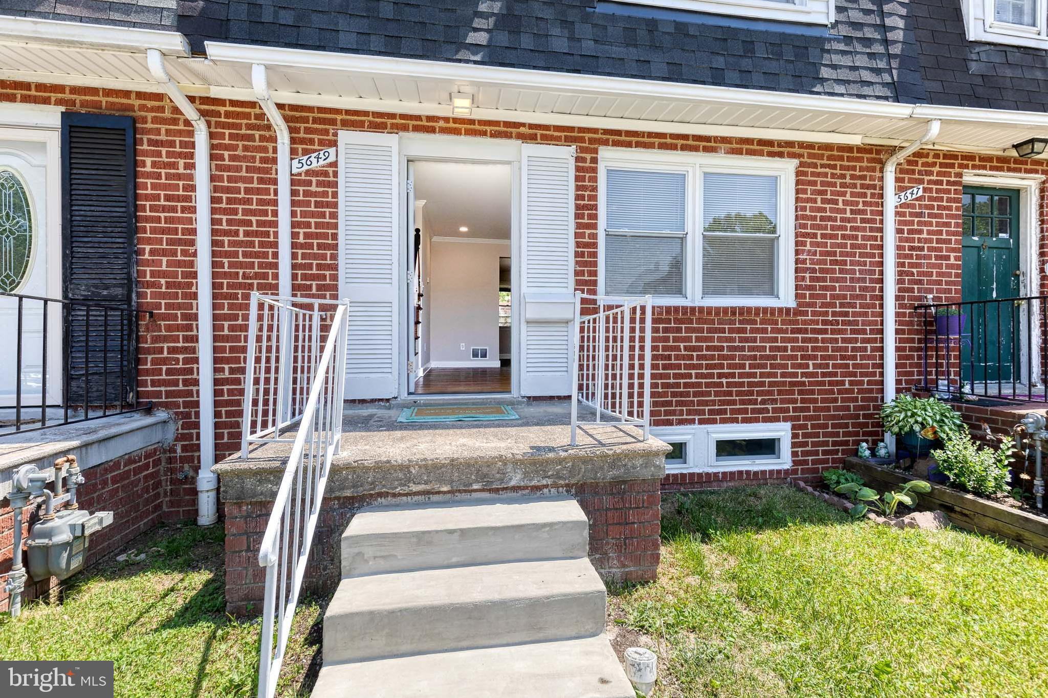 5649 Utrecht Road Baltimore, MD 21206 - Photo 3 of 42 a front view of a house with a yard