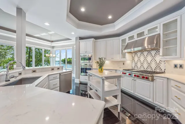 a kitchen with a sink stove and cabinets