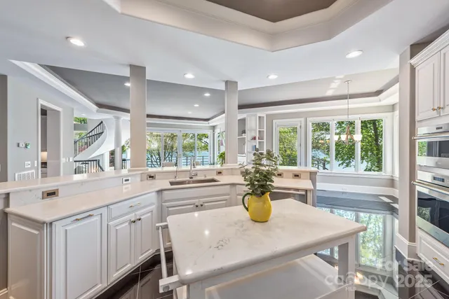 a kitchen with a sink appliances and cabinets