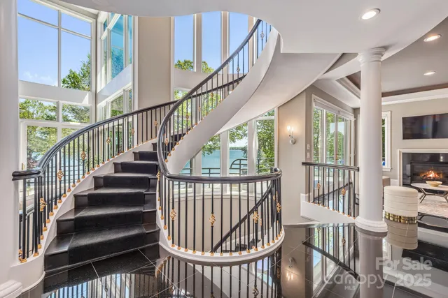 a view of entryway with wooden floor and front door