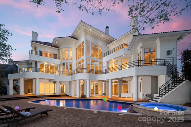 a front view of a residential apartment building with a yard