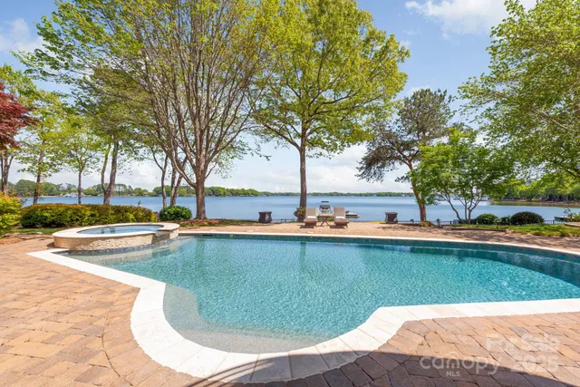 a view of a swimming pool and lounge chair