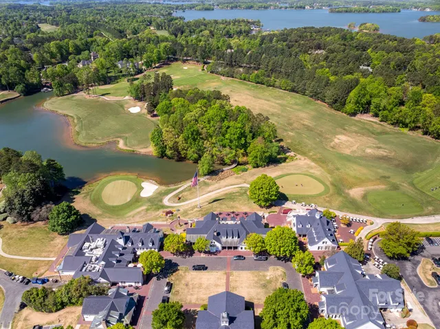 an aerial view of a residential houses with outdoor space