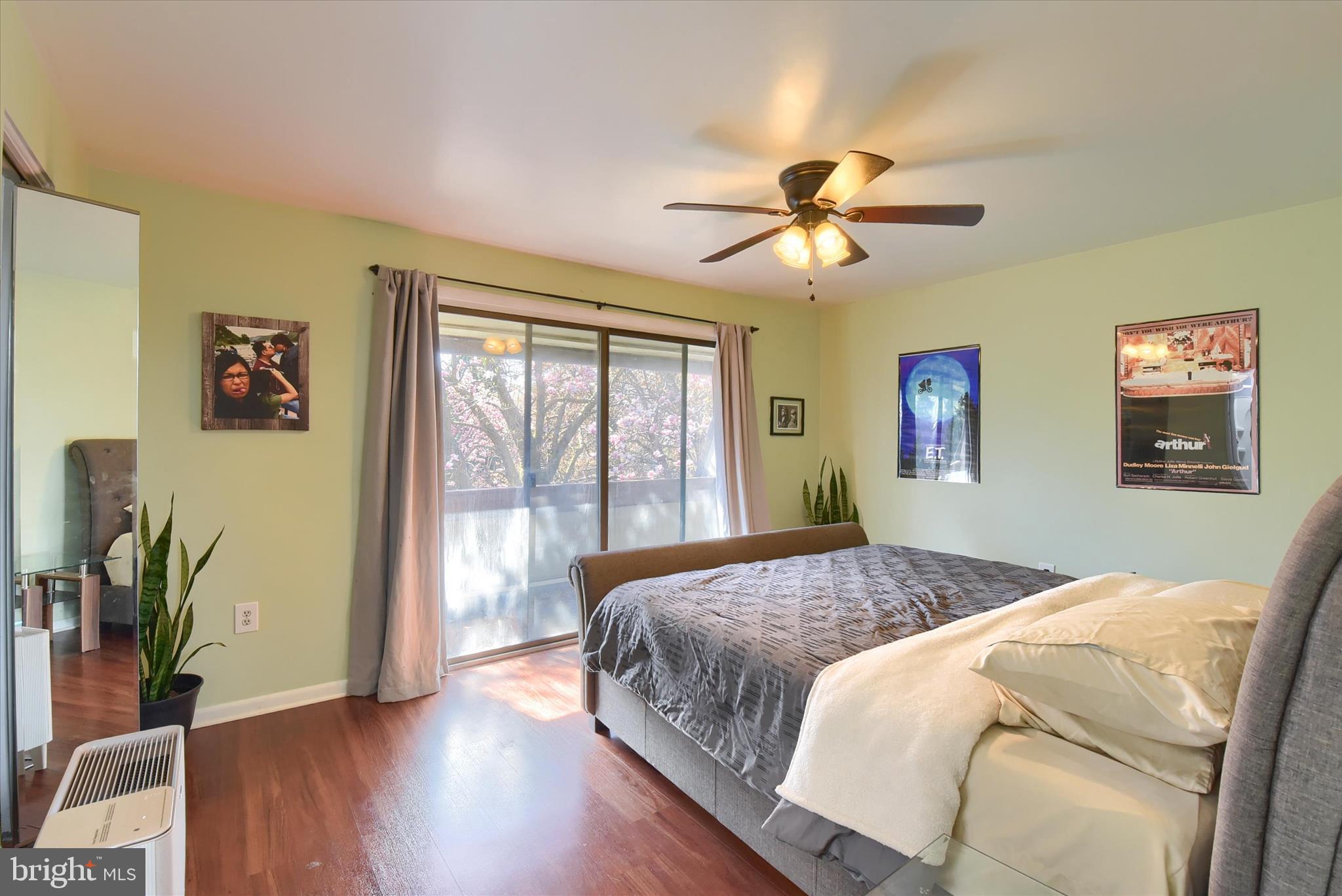 704 Cedar Ridge Lane Mechanicsburg, PA 17055 - Photo 18 of 40 a bedroom with a large bed and a chandelier