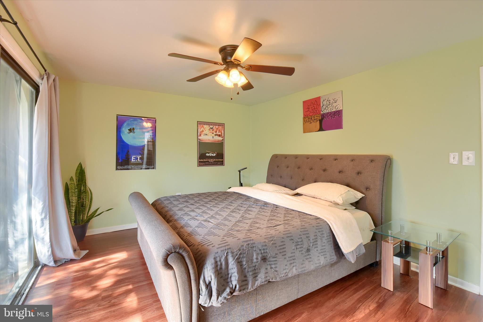 704 Cedar Ridge Lane Mechanicsburg, PA 17055 - Photo 19 of 40 a bedroom with a bed and a chandelier