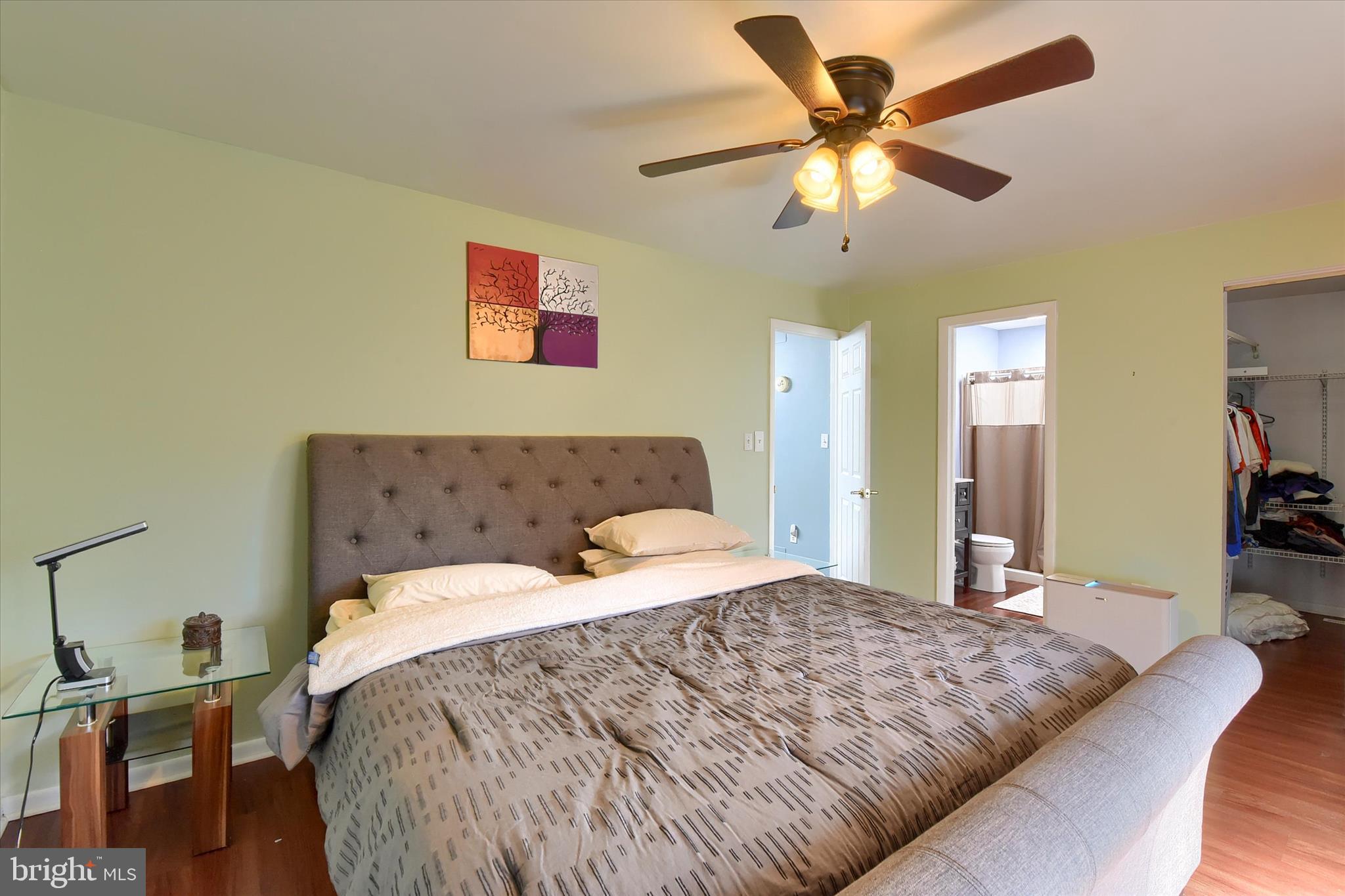 704 Cedar Ridge Lane Mechanicsburg, PA 17055 - Photo 20 of 40 a bedroom with a bed and a chandelier