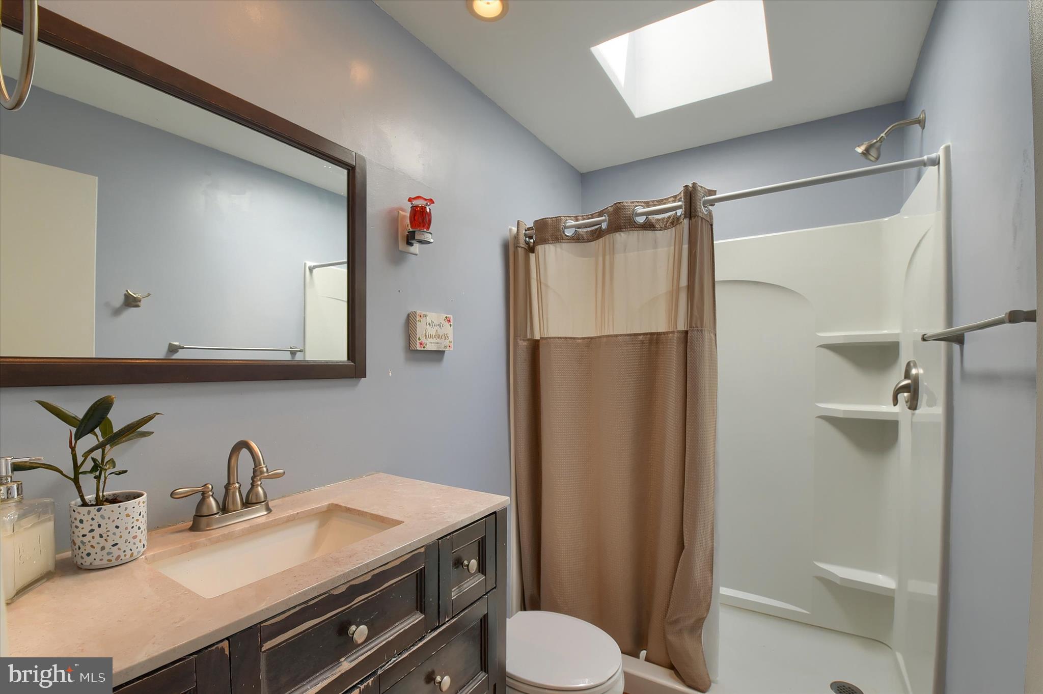 704 Cedar Ridge Lane Mechanicsburg, PA 17055 - Photo 22 of 40 a bathroom with a granite countertop sink toilet and shower