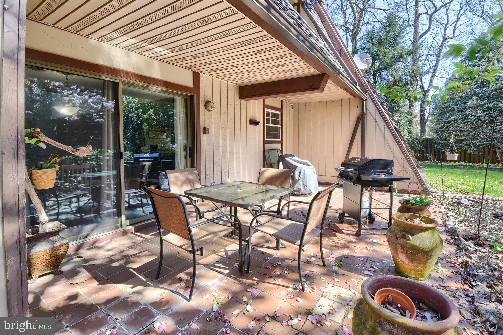 704 Cedar Ridge Lane Mechanicsburg, PA 17055 - Photo 36 of 40 a patio with table and chairs and potted plants