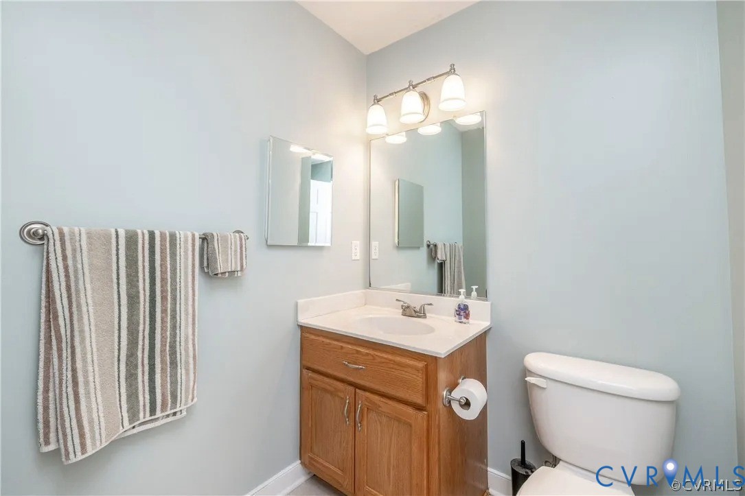 1733 Lakeview Avenue Richmond, VA 23220 - Photo 16 of 28 a bathroom with a sink a toilet and a mirror