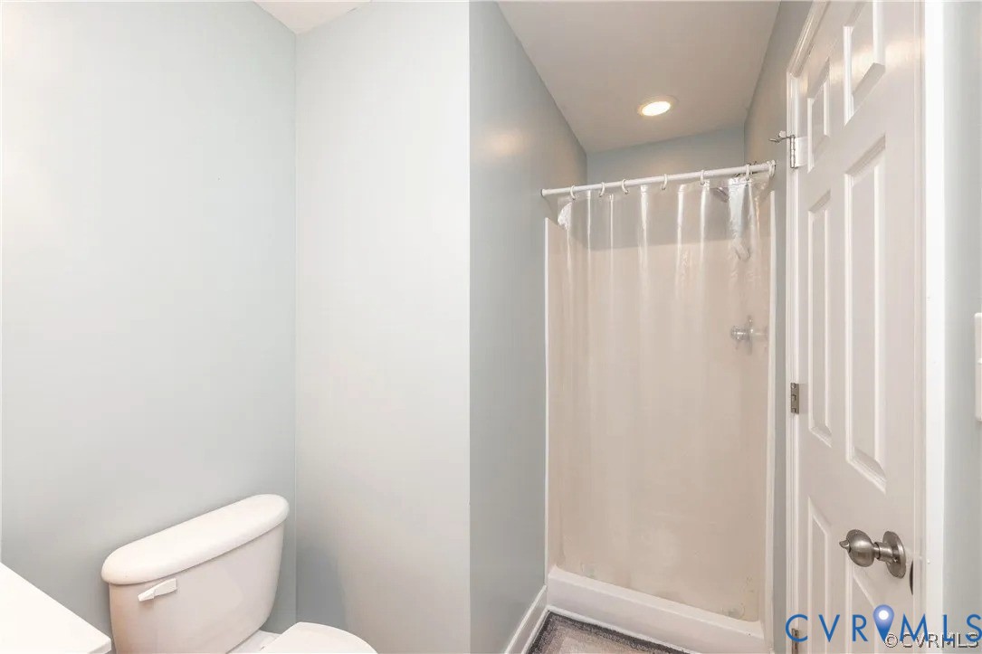 1733 Lakeview Avenue Richmond, VA 23220 - Photo 17 of 28 a bathroom with a toilet and a shower