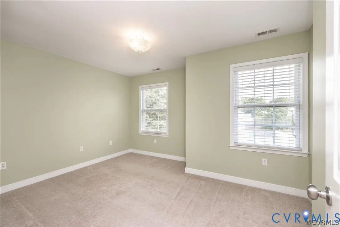 1733 Lakeview Avenue Richmond, VA 23220 - Photo 21 of 28 an empty room with windows