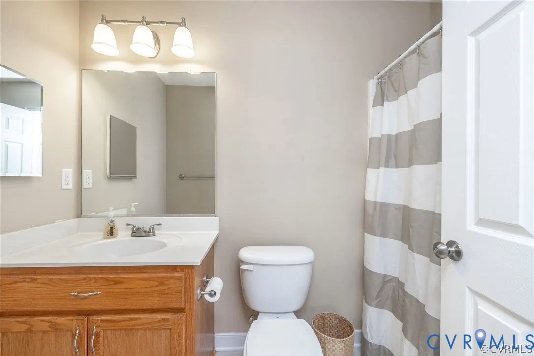 1733 Lakeview Avenue Richmond, VA 23220 - Photo 22 of 28 a bathroom with a sink toilet and shower