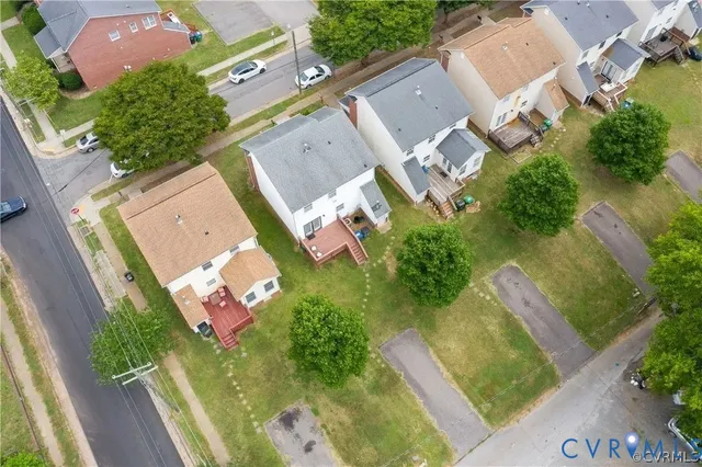 an aerial view of a house with a yard