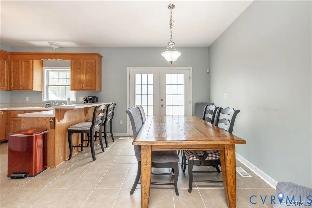 1733 Lakeview Avenue Richmond, VA 23220 - Photo 10 of 28 a view of a a dining room with furniture window and wooden floor