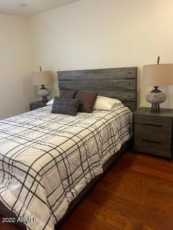 a bedroom with a bed and a dresser