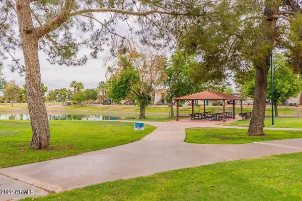 a front view of a house with a yard and a garage