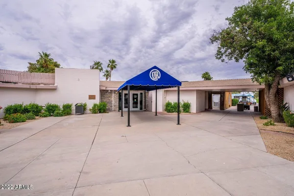 a view of a park with bench and trees