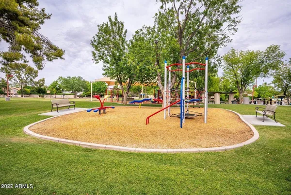 a front view of a house with a yard table and chairs