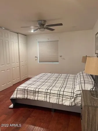 a bedroom with a bed and window