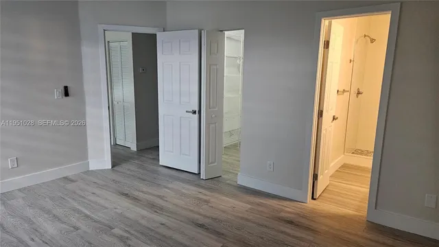 a view of entryway with wooden floor