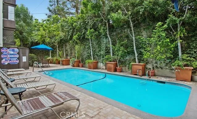 an outdoor space with furniture and umbrella