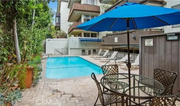 a view of a building with a swimming pool