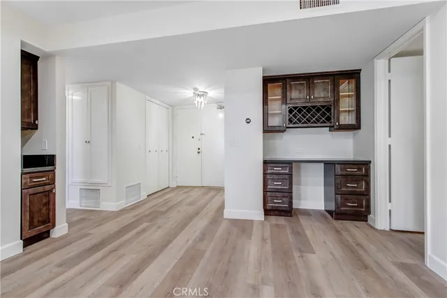 a view of a kitchen with a sink and a refrigerator