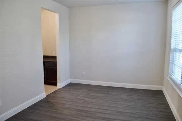 a bathroom with a shower and a sink