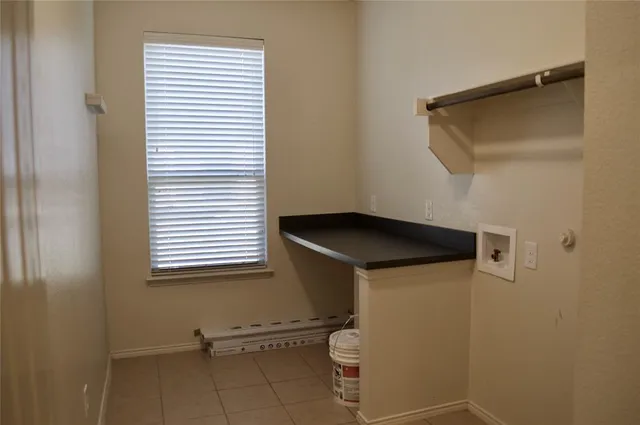 a kitchen with stainless steel appliances wooden cabinets and a stove top oven