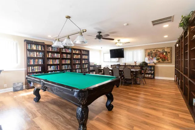 a room with lots of table and chairs